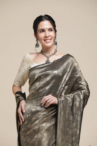 Woman wearing a traditional saree with a beige background