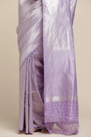 Lavender saree with a plain background