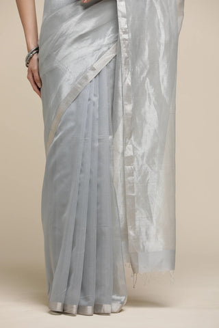 Gray saree with a subtle pattern on a beige background