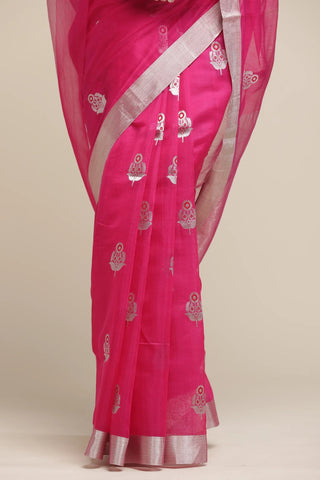 Pink saree with silver patterns on a beige background