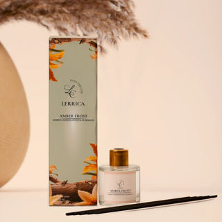 Lermeria Amber Frost perfume bottle with packaging and decorative elements on a neutral background